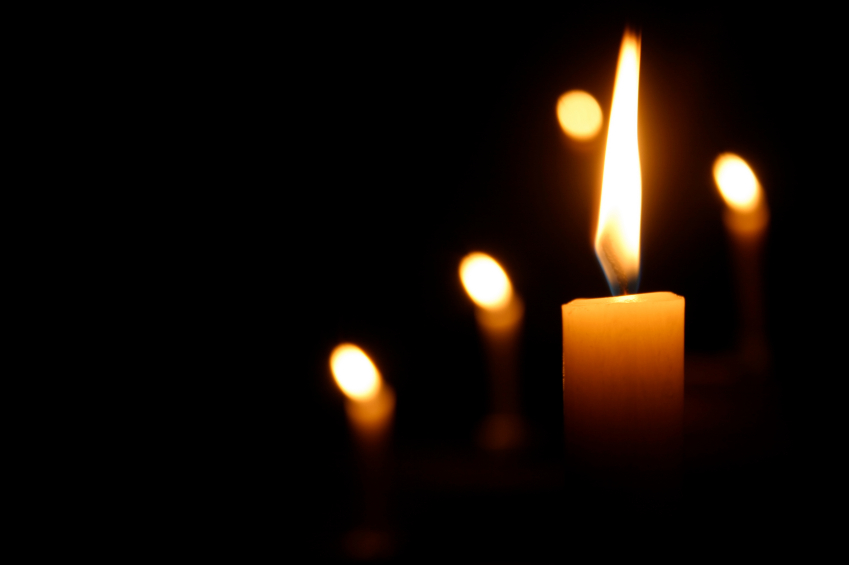 Candles Burning in Dark Church